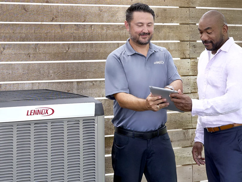 Allianz-AC-Installation-808×606 Allianz Heating and Air technician helping customer with air conditioner unit