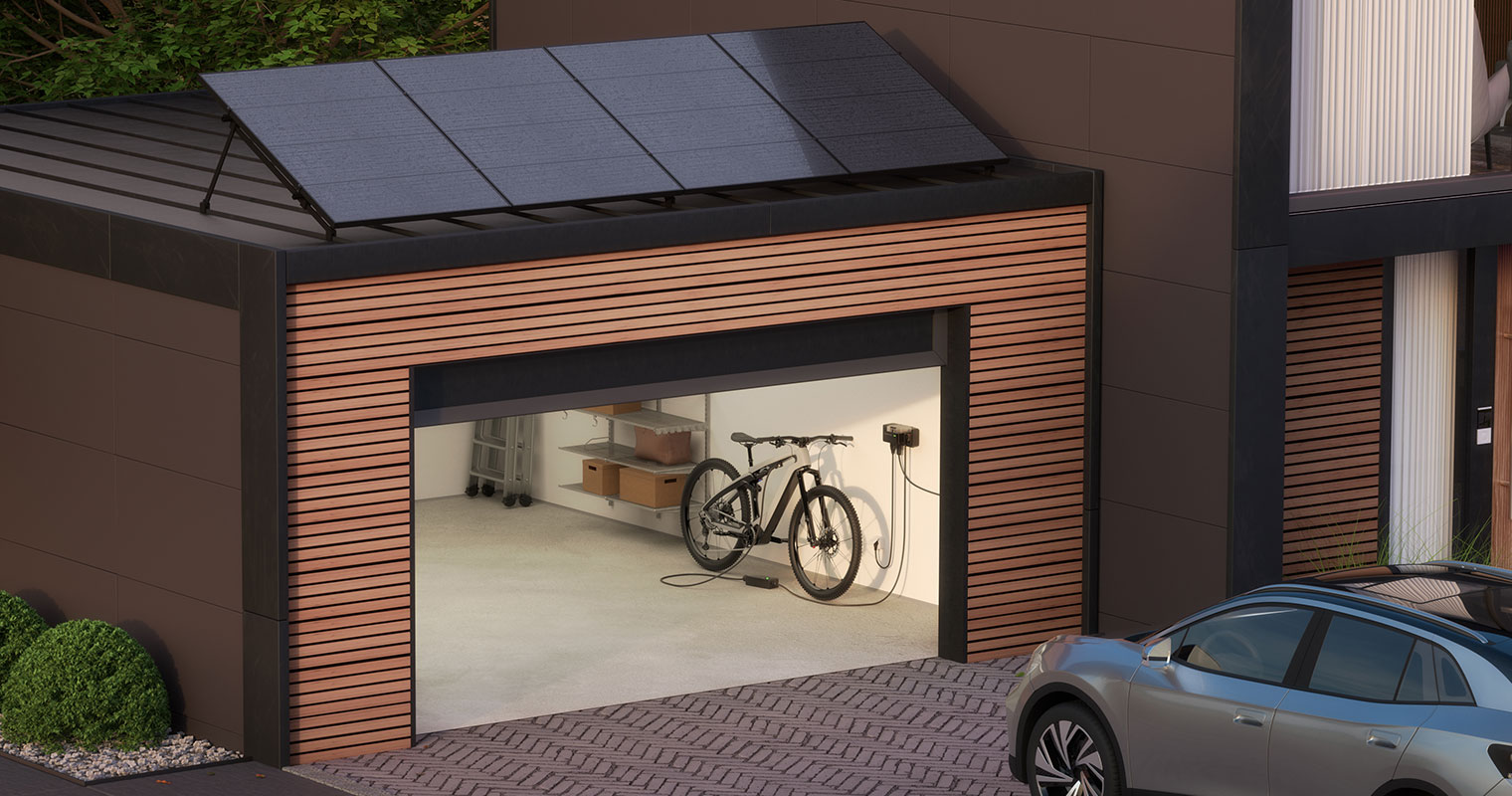 Garage with solar panels on the top and a plug in space inside the garage